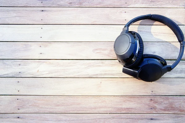 Headphones on the wood surface