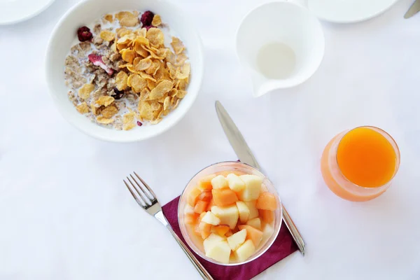Healthy breakfast on the white table in the restaurant. top view