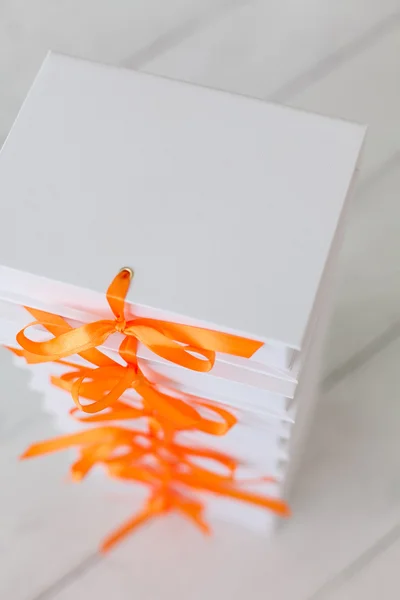 White gift boxes on a white wooden background. White gift boxes.