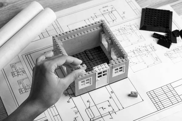 Mechanical engineer at work. Technical drawings. Paper with technical drawings and diagrams.