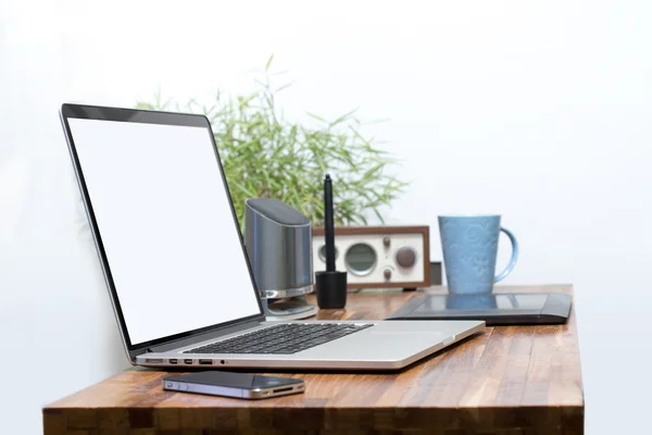 Blank screen laptop on wooden desk blank screen