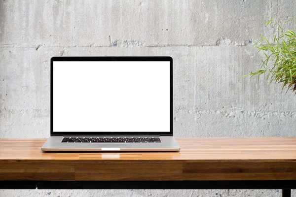 Laptop on wooden desk