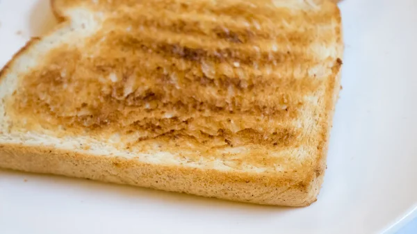 Tasty bread toast on white plate