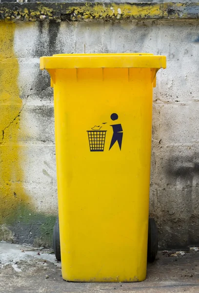 Single yellow dustbin with symbol