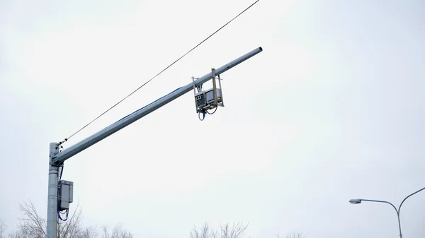 The system of video fixing of traffic rules on the road against the winter sky