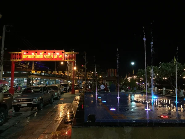 Ratchaburi, Thailand - August 9, 2016: Koi Kee Old Chinese Market Post nearby Ratchaburi river full of Pokemon Go players at night. The players are all energetic and eager to catch new pokemon and beat the gym till one to two a.m. over night.