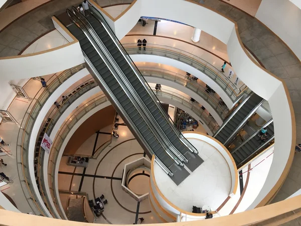 Bangkok, Thailand - Sep 17, 2016: Inside architecture of Bangkok Art and Cultural Centre, shoot from 9th floor. The picture shows round shape of corridors and escalators inside the place.