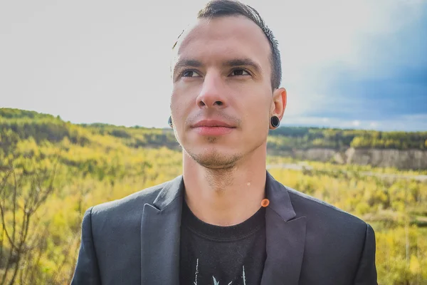 Russian smiling young man looking at the sky