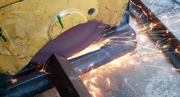 Worker cut iron bar from electric cutter