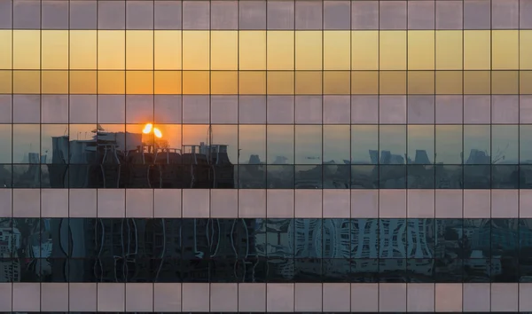 Reflection Of Twilight Sunset Cityscape Scene On Windows Of Skys