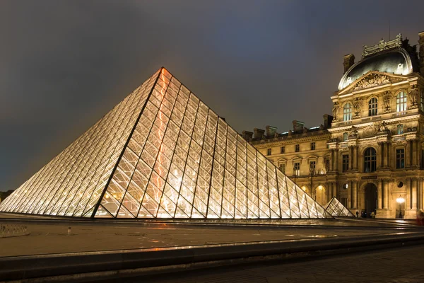 The  Louvre Pyramid at night, Paris, France.