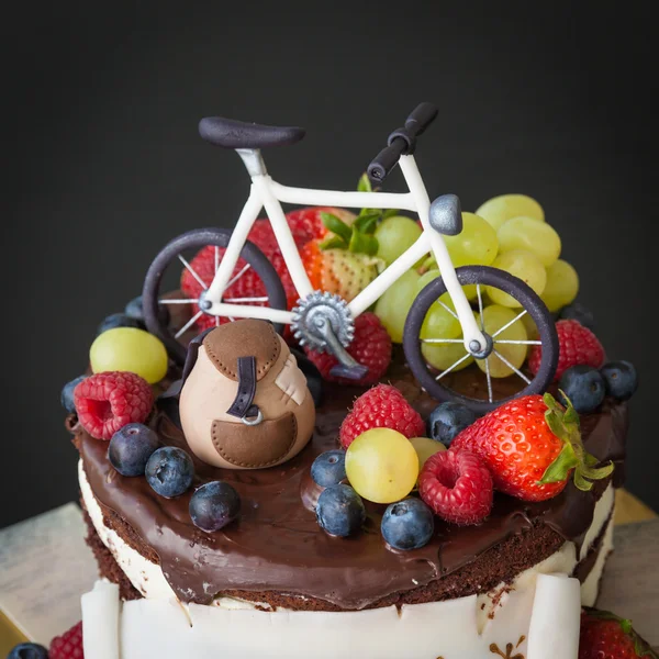 Chocolate cake with fresh fruit on the theme of travel