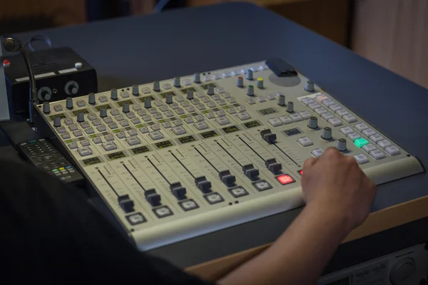 The music desk in a sound studio directly controls the radio tra