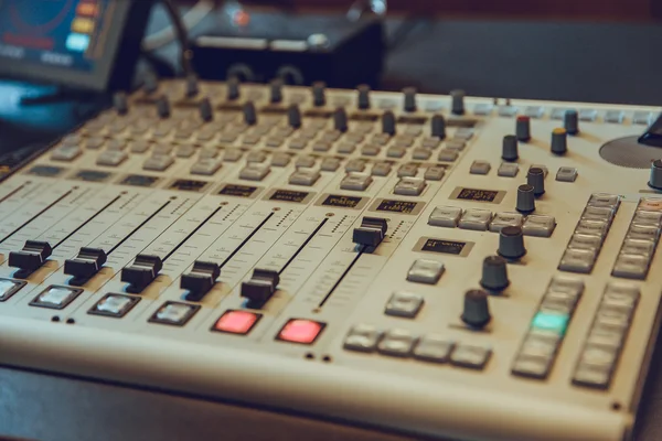 The music desk in a sound studio directly controls the radio tra