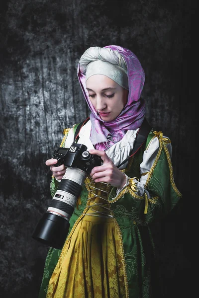 Medieval woman holds SLR camera
