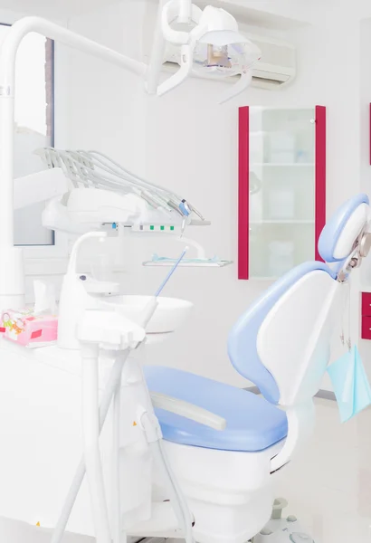 Dental office with blue dental chair