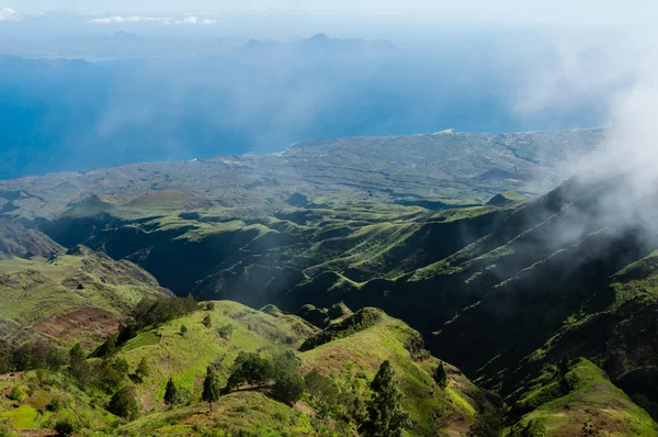 Steep green valley viewpoint leading to blue ocean coast of cape verde island