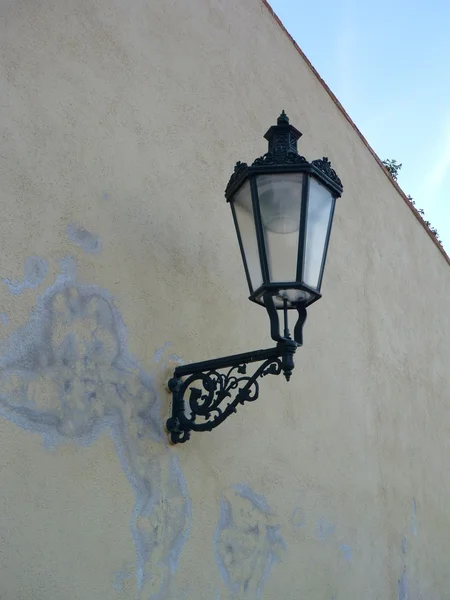 Historical decorative lamp on an old wall
