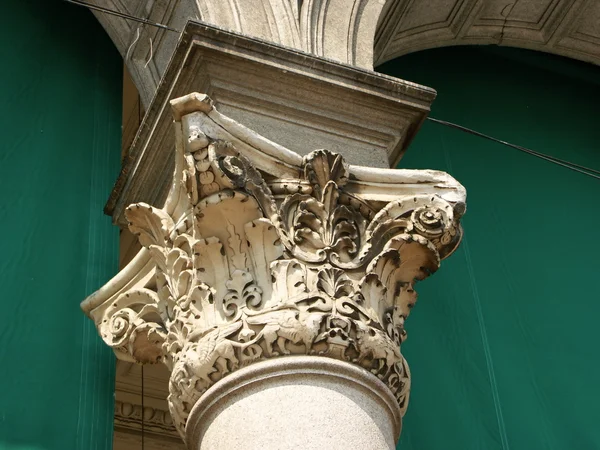 Historical decorated carved stone column