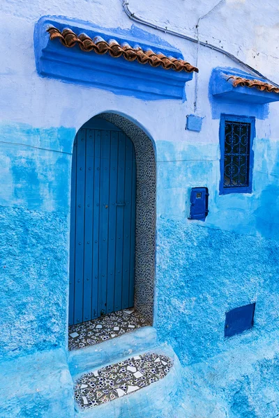 Door and window in the town of Chefchaouen, in Morocco