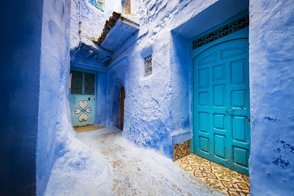 Doors and a window in the town of Chefchaouen, in Morocco