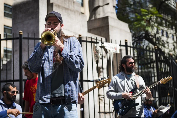 Street musicians playing in a street in the city of Buenos Aires, in Argentina