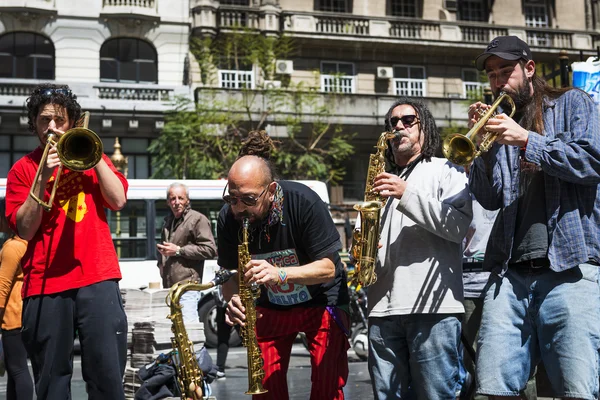 Street musicians playing in a street in the city of Buenos Aires, in Argentina