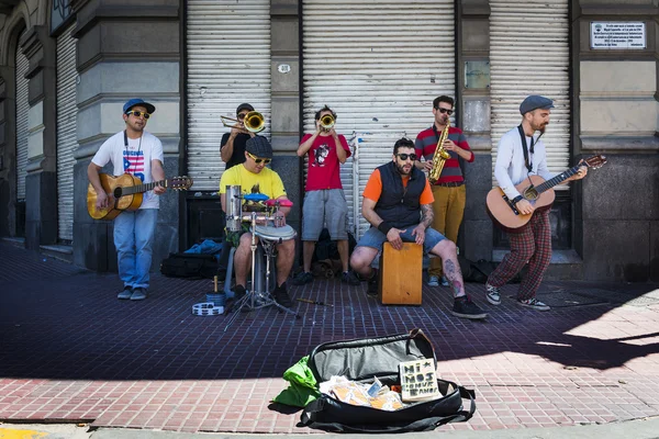 Street musicians playing in a street in the San Telmo neighborhood in the city of Buenos Aires, in Argentina