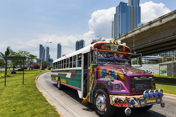 Red Devil Bus (Diablo Rojo) in a street of Panama City. Red Devil buses are public transports painted in bright colors and symbols.