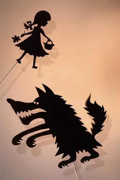 Shadow puppets of Little Red Riding Hood and Wolf