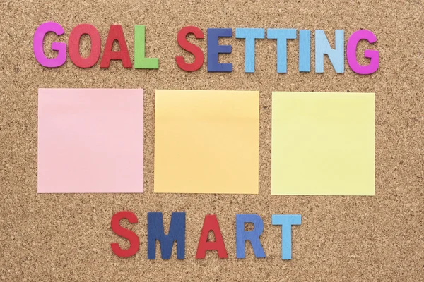 Words goal setting and smart with blank notepad