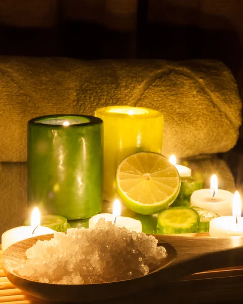 Spa and wellness setting green and yellow candles lit, lemon Green