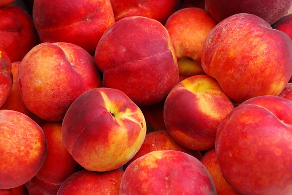 Heap of Fresh Organic Peaches background