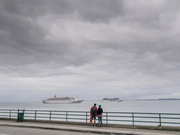 Couple watching the ship.