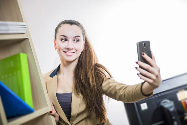 Pretty girl student office worker taking selfie