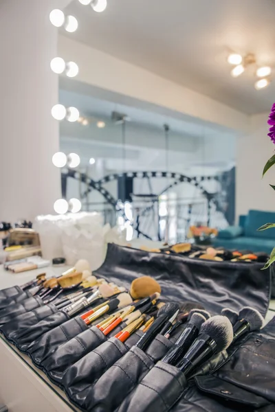 The mirror in the dressing room and makeup brush