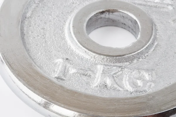 Metal weight of one kg closeup