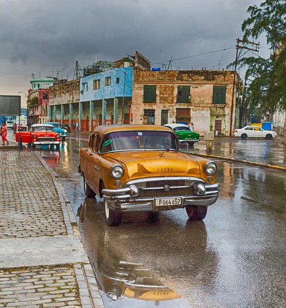 Old car on wet road