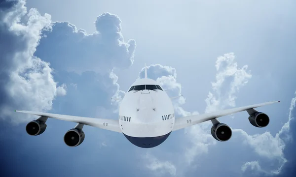 White plane flying in sky and clouds. Airplane boeing 747