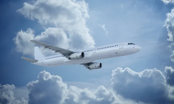 White plane flying in sky and clouds. Airplane airbus a321.