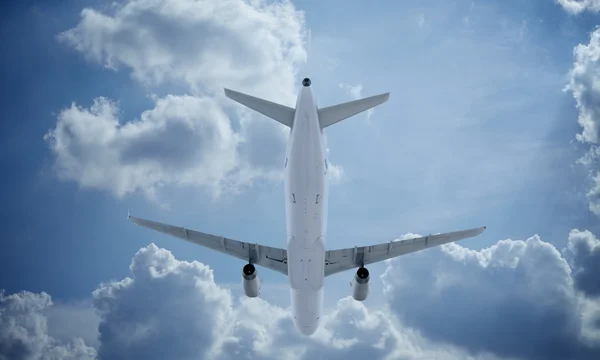 White plane flying in sky and clouds. Airplane airbus a321.