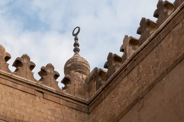 An Islamic crescent on top of a mosque