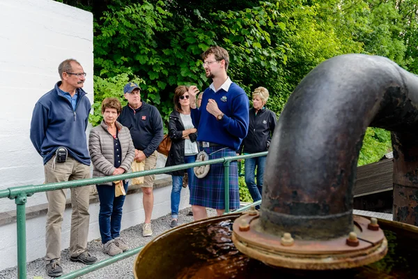 Visitors and tour guide at Edradour Distillery