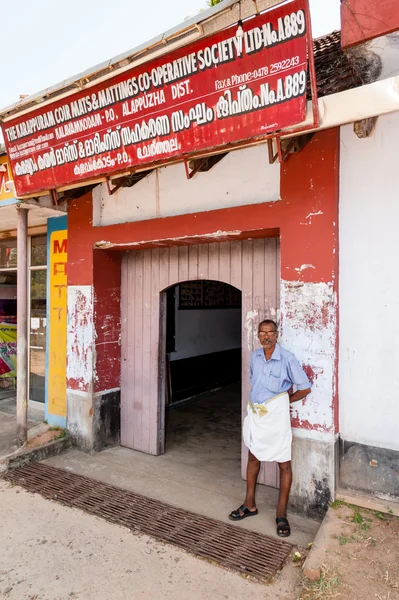 Man outside a co-operative factory