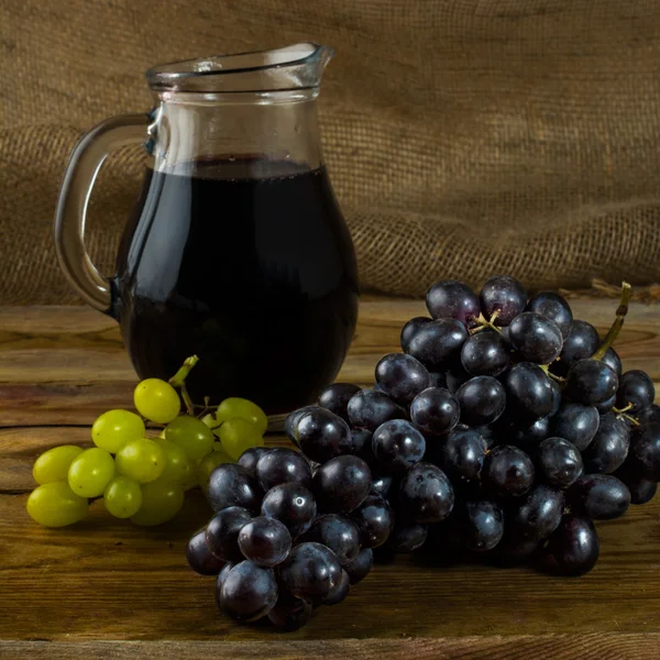Bunch of grapes and Wine jug