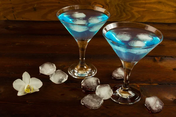 Blue cocktail in a martini glasses