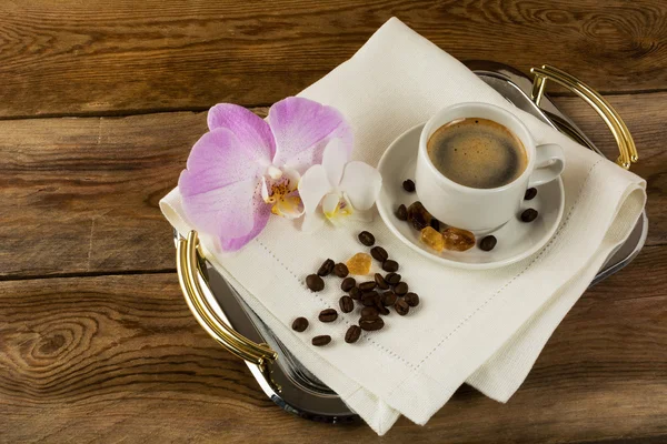 Coffee cup with white and pink orchids