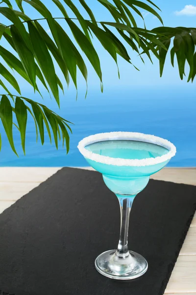 Blue cocktail on the tropical beach