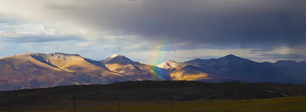 Rainbow in the mountains panorama