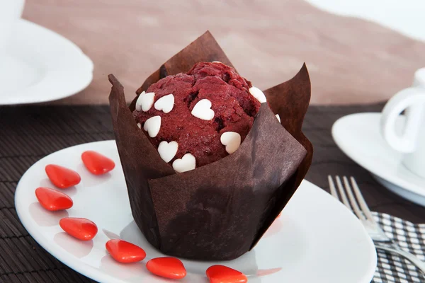 Muffin cake stuffed with chocolate wrapped in soft sponge cake